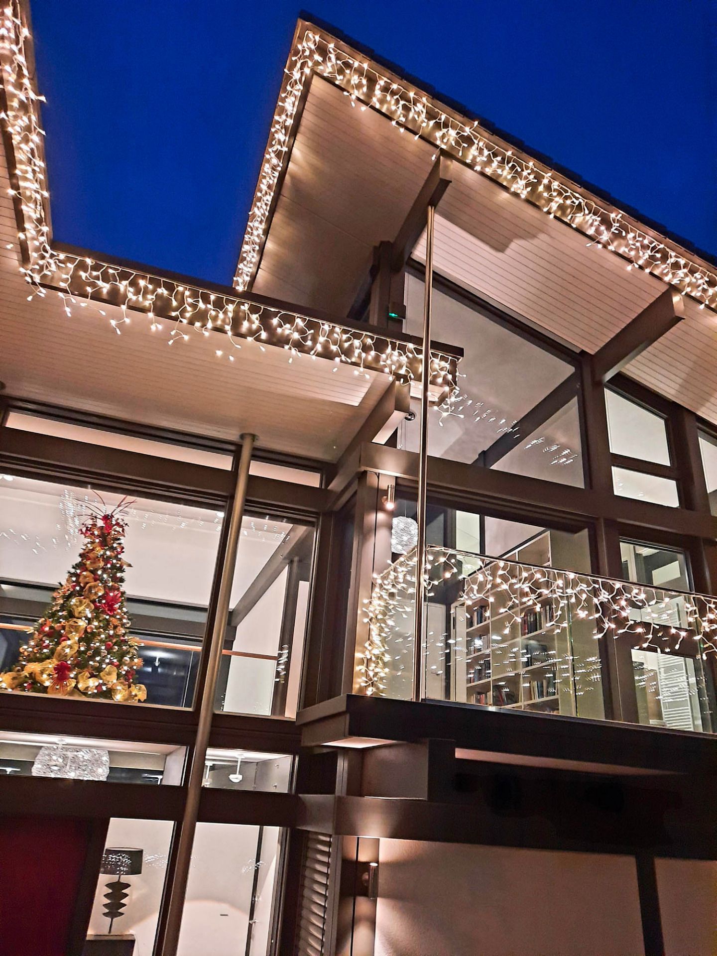 Icicle lighting installed across a commercial building frontage